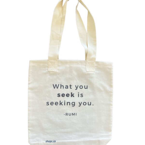 White cotton tote bag with black Persian-style calligraphy of the Rumi quote