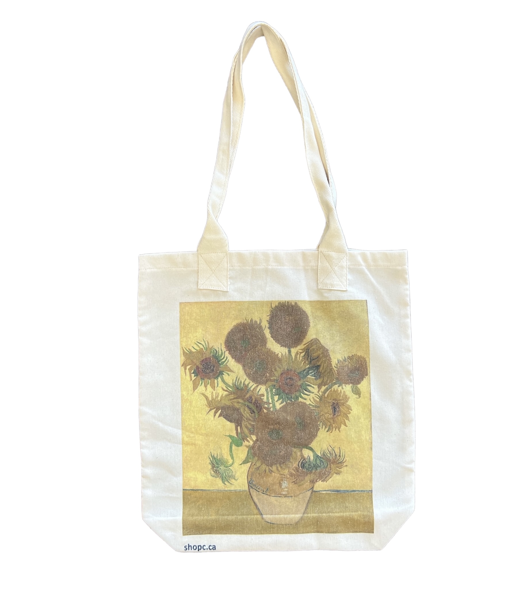 Tote bag printed with Van Gogh’s painting Vase with Fifteen Sunflowers, showing bright yellow sunflowers in a rustic vase.