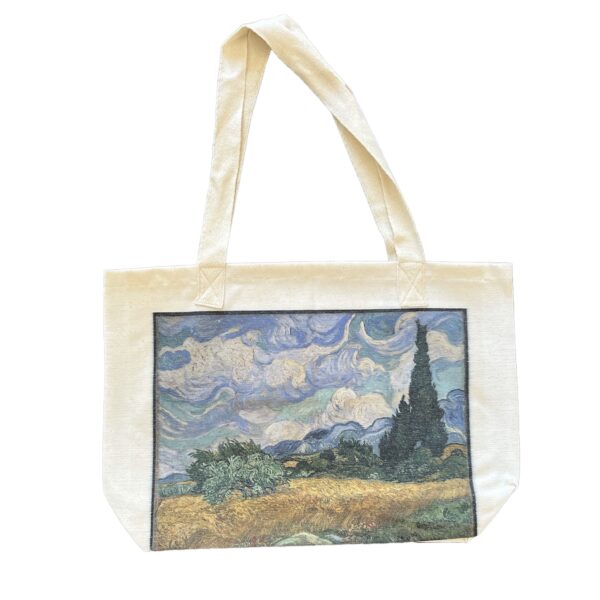 Tote bag printed with Van Gogh’s Wheat Field with Cypresses, featuring swirling skies, golden wheat fields, and dark green cypress trees.